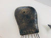 back view of metal octopus hook attached