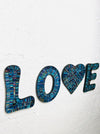 side view of love mosaic letters