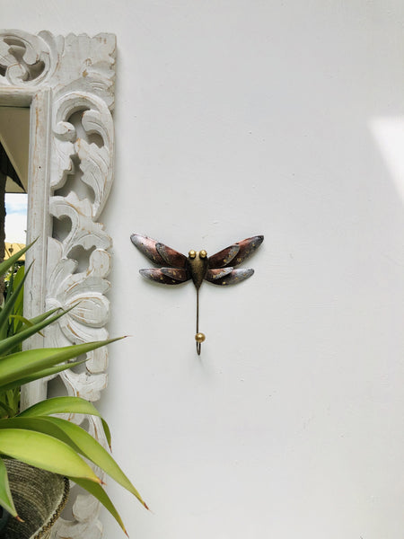 display view of metal dragonfly hook attached on the wall