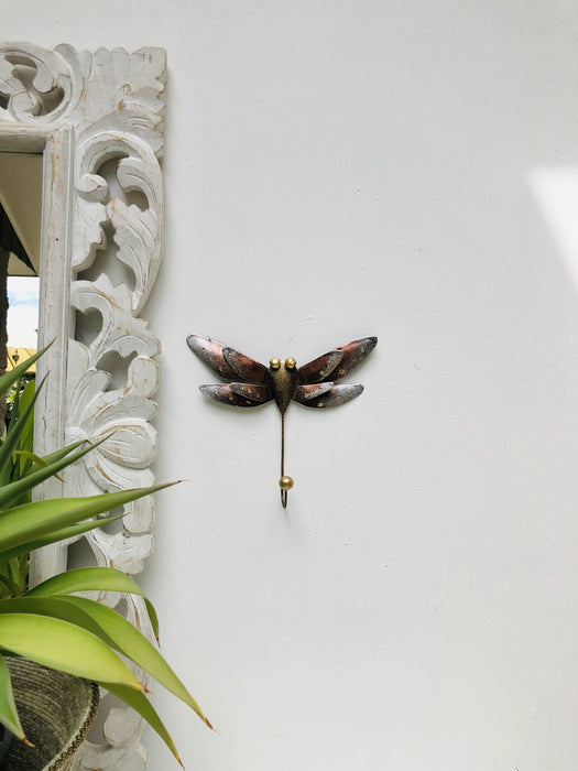 display view of metal dragonfly hook attached on the wall