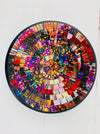 Top view of handmade mosaic glass bowl in Broadway design, featuring vibrant red, gold, blue and white glass mosaic pieces.