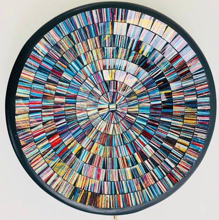 Top view of handmade mosaic glass bowl in Miami colours showing circular pattern of blue, red and gold glass pieces.