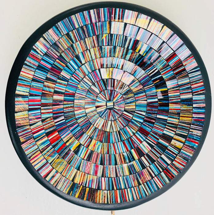 Top view of handmade mosaic glass bowl in Miami colours showing circular pattern of blue, red and gold glass pieces.