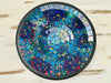 Top view of handmade mosaic glass bowl in Reef tones showing circular pattern of turquoise, violet and ocean blue glass tiles.