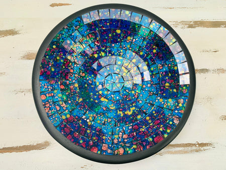 Top view of handmade mosaic glass bowl in Reef tones showing circular pattern of turquoise, violet and ocean blue glass tiles.