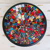Top view of handmade mosaic glass bowl in Starburst tones showing vivid circular pattern with red, gold and blue glass pieces.