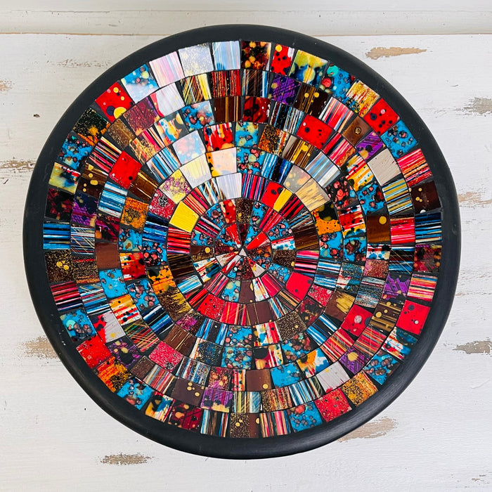 Top view of handmade mosaic glass bowl in Starburst tones showing vivid circular pattern with red, gold and blue glass pieces.
