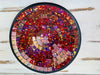 Top view of handmade mosaic glass bowl in Violet Burst tones showing circular pattern of purple, magenta and gold glass pieces.