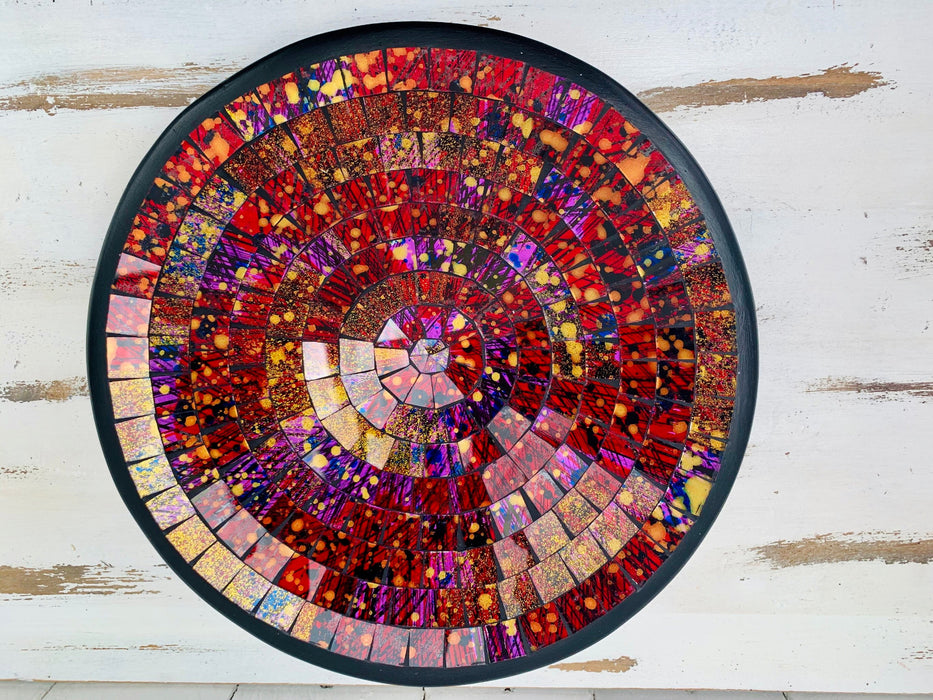 Top view of handmade mosaic glass bowl in Violet Burst tones showing circular pattern of purple, magenta and gold glass pieces.