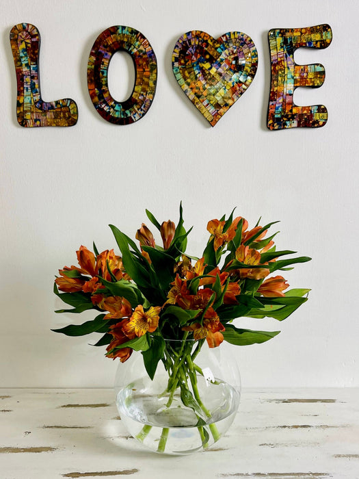 front view of mosaic love letters hung on wall