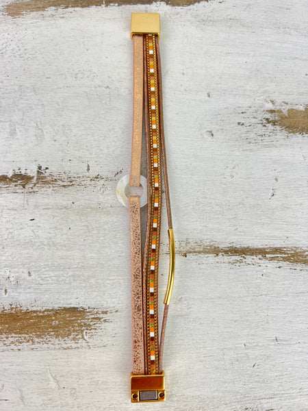 Multi strand bracelet with magnetic closure.