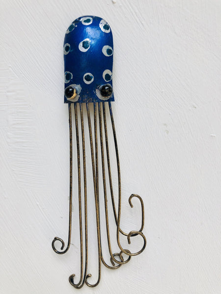 Hand-painted blue metal octopus wall decoration with long curled tentacles