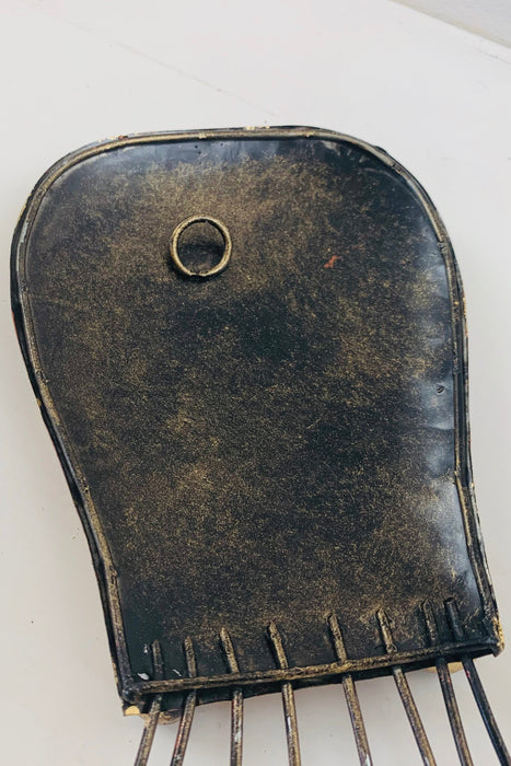 Back of copper octopus metal wall art showing hanging point and metal finish