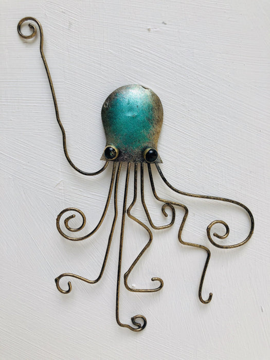 Hand-painted green metal octopus wall decoration with curled tentacles
