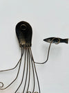 Back of copper octopus metal wall art showing hanging eyelet and metal structure