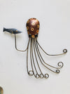 Hand-painted copper metal octopus wall decoration with curled tentacles and small decorative fish
