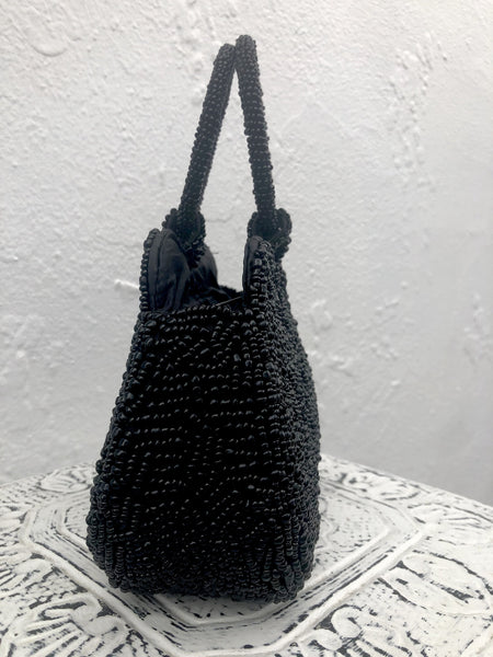 side view of black beaded handbag