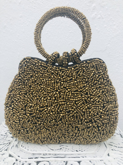 front view of gold beaded handbag