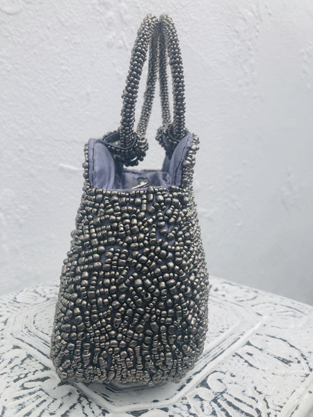 side view of silver beaded handbag