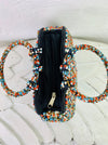 aerial view of beaded handbag with zip opening