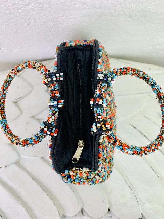 aerial view of beaded handbag with zip opening