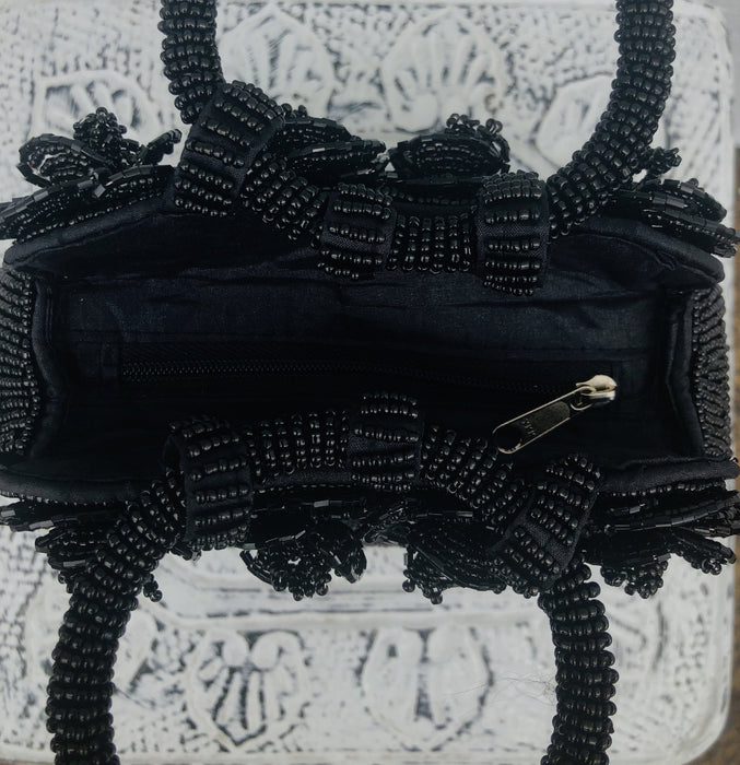 aerial view of beaded handbags opening with zip