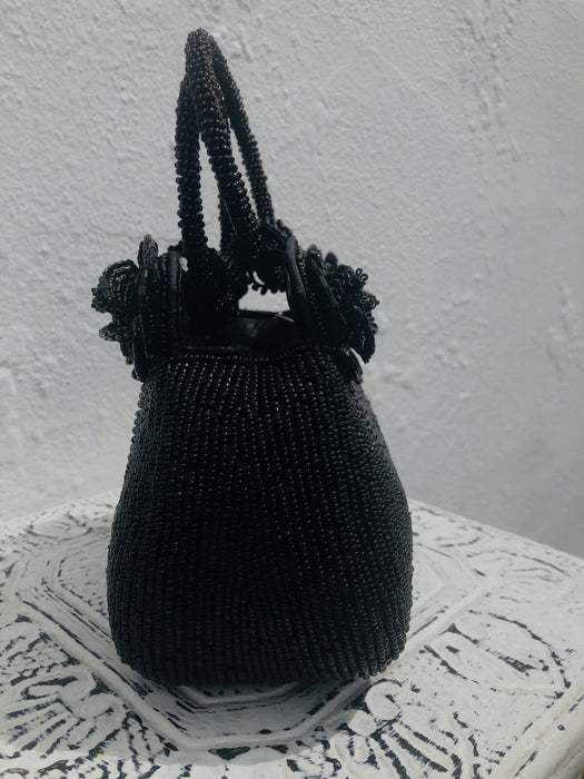 side view of black beaded handbag