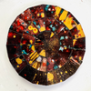 Close-up view of the Siena mosaic coaster showing detailed hand-painted glass pieces in warm earthy tones.