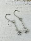 delicate six-pointed star charms on long fishhook wires.