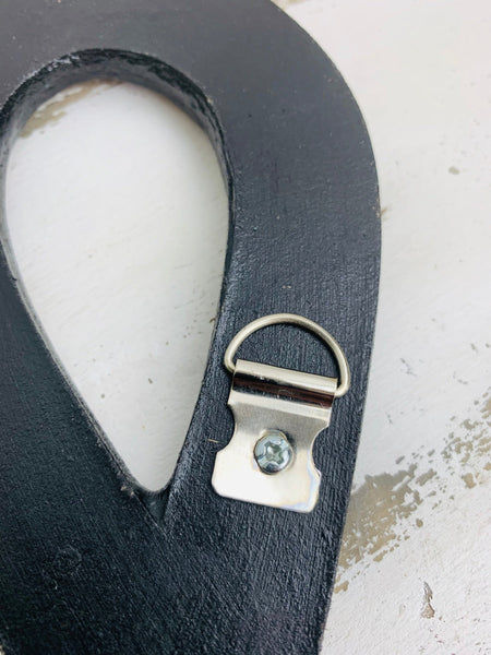 close up of treble clef hook