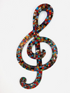 front view of mosaic treble clef in multi colours on white background
