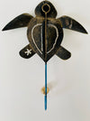 Back view of handmade turtle metal wall hook.