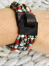 Multicolour beaded bracelet with a wooden buckle and wooden clasp detail
