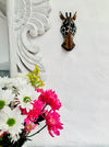 display view of zebra wood mask on wall