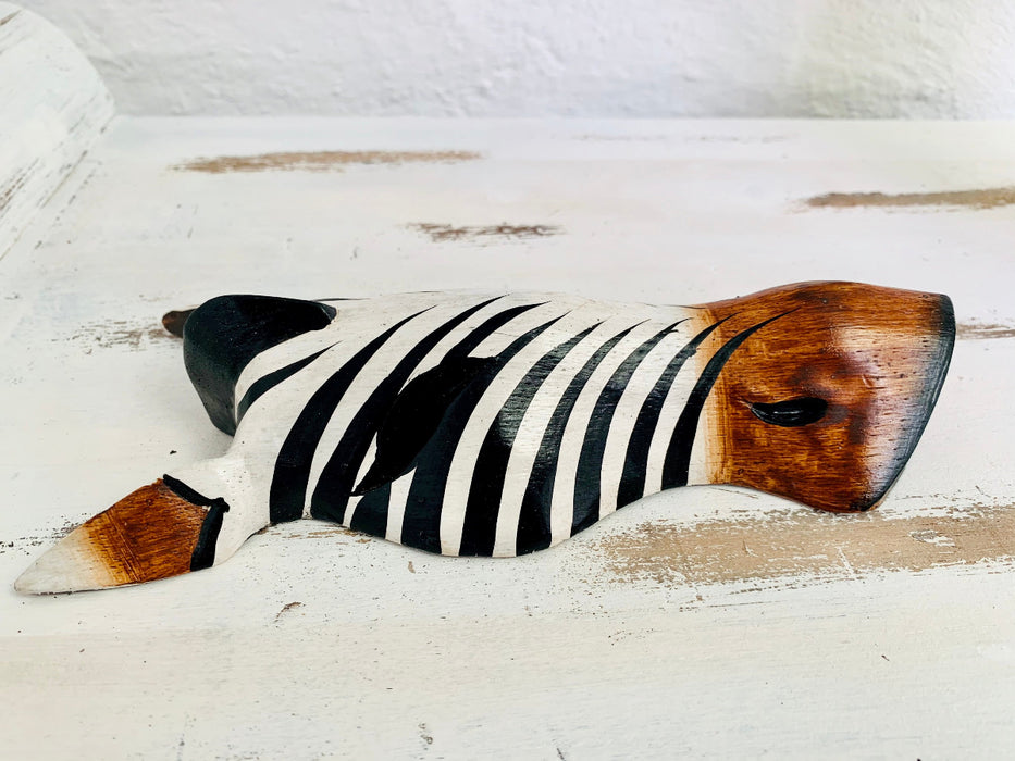 side close up of wood zebra mask